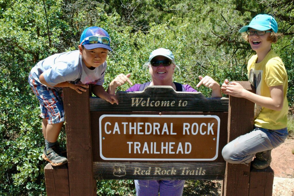 Author's family posing at the Cathedral Rock Trailhead in Sedona, Arizona.