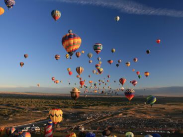 Hundreds of hot-air balloons takeoff each morning and land around various parts of Albuquerque, New Mexico just in time to pack them up and go to brunch.