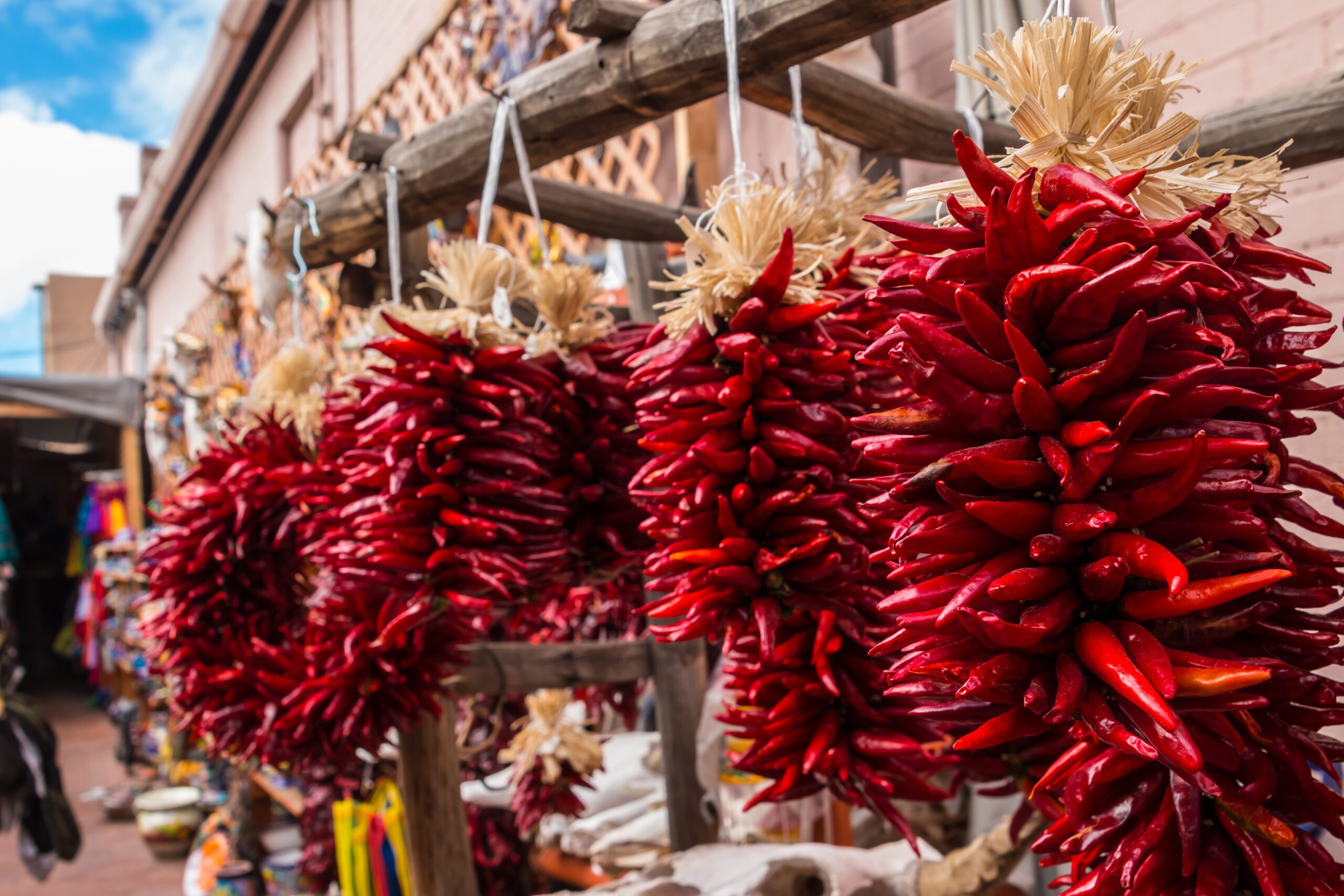 Red Chili Pepper Ristras hang in an open-air market in Santa Fe,New Mexico.